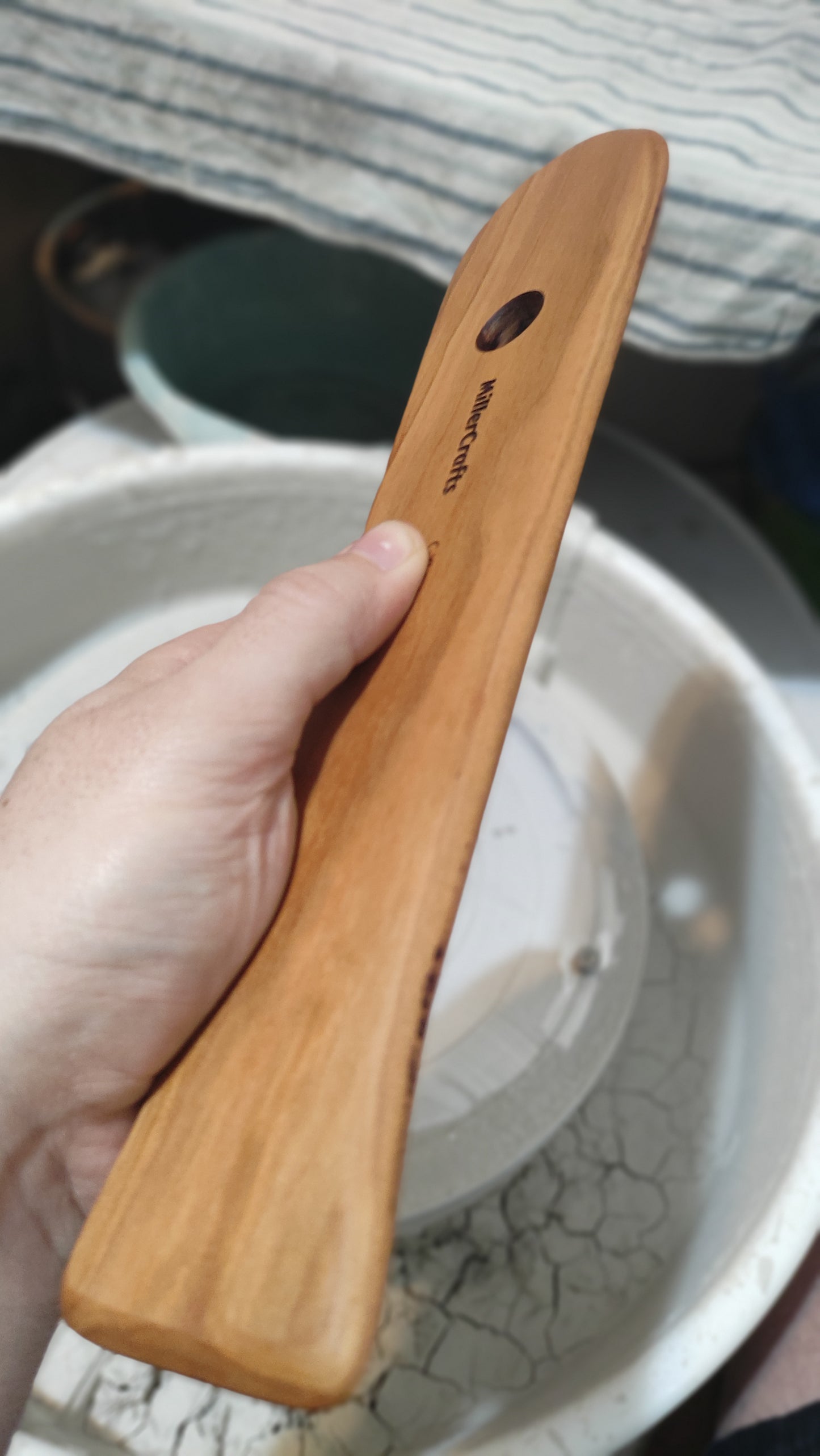 C-XL7 Pottery tool rib, elongated shape with open foot.